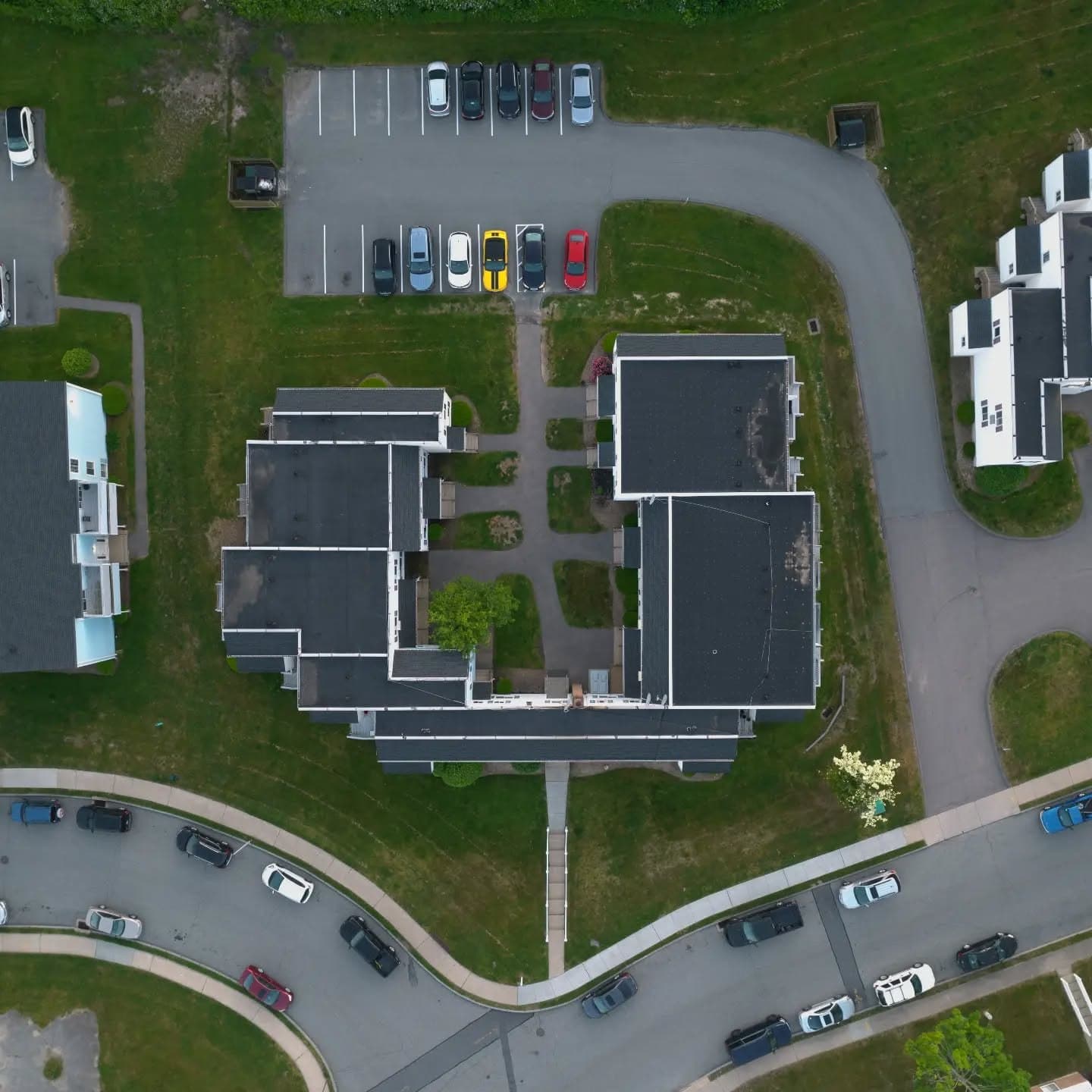 Top-down drone view of Eagle Pointe Apartments and its parking lot